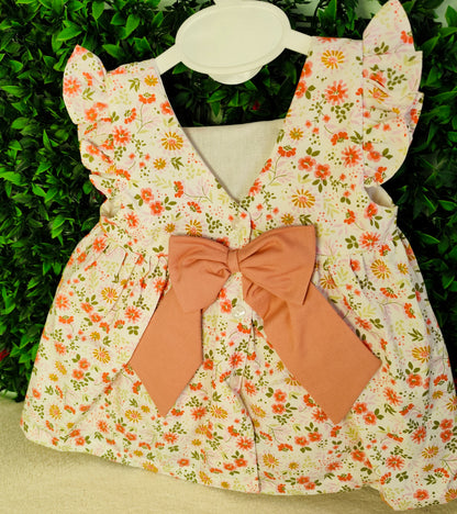 Vestido florido com laço
